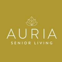 White lotus line-art above “AURIA SENIOR LIVING” on a mustard-gold square background.
